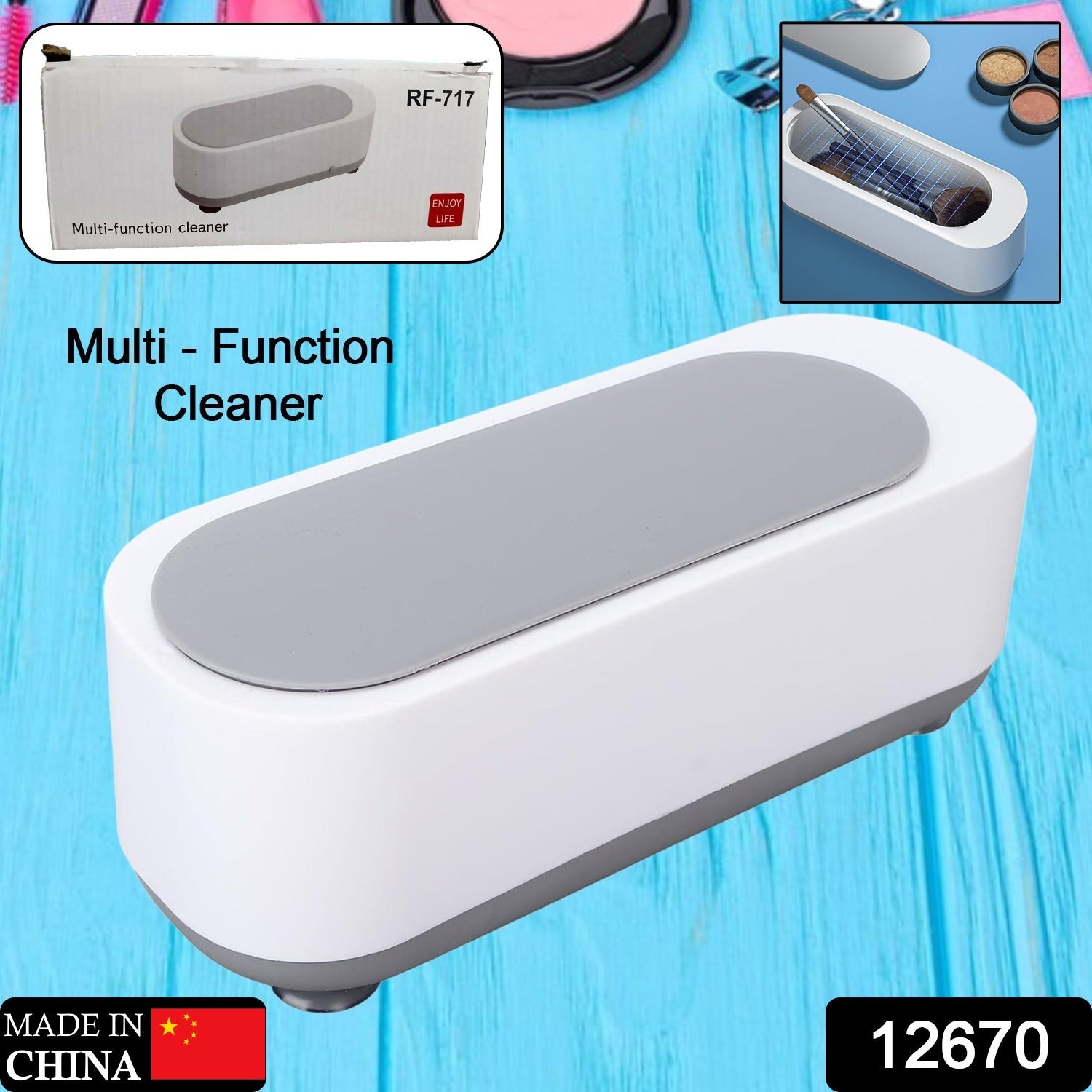 Ultrasonic jewellery cleaner actively cleaning a watch and several rings.
