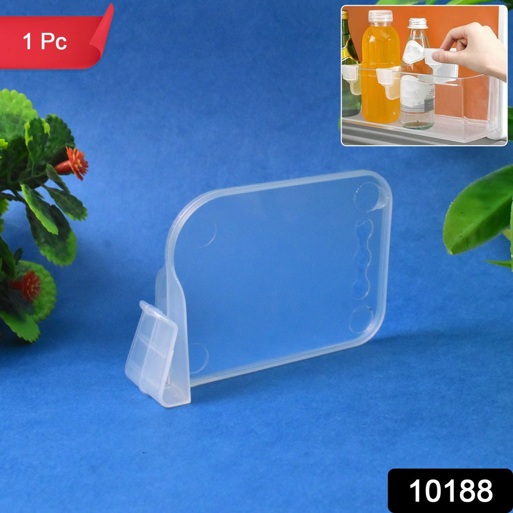 Plastic refrigerator organizer basket in use holding bottles and cans