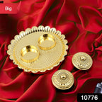 Overhead view of the round Puja Thali, showcasing its fixed Kumkum holders.
