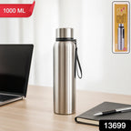 Person holding the sleek  1000ml Stainless Steel Water Bottle in a casual setting.