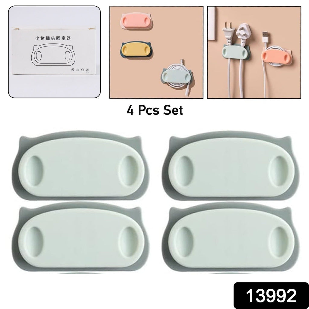 Close-up of pig-shaped cable holder clips organizing wires