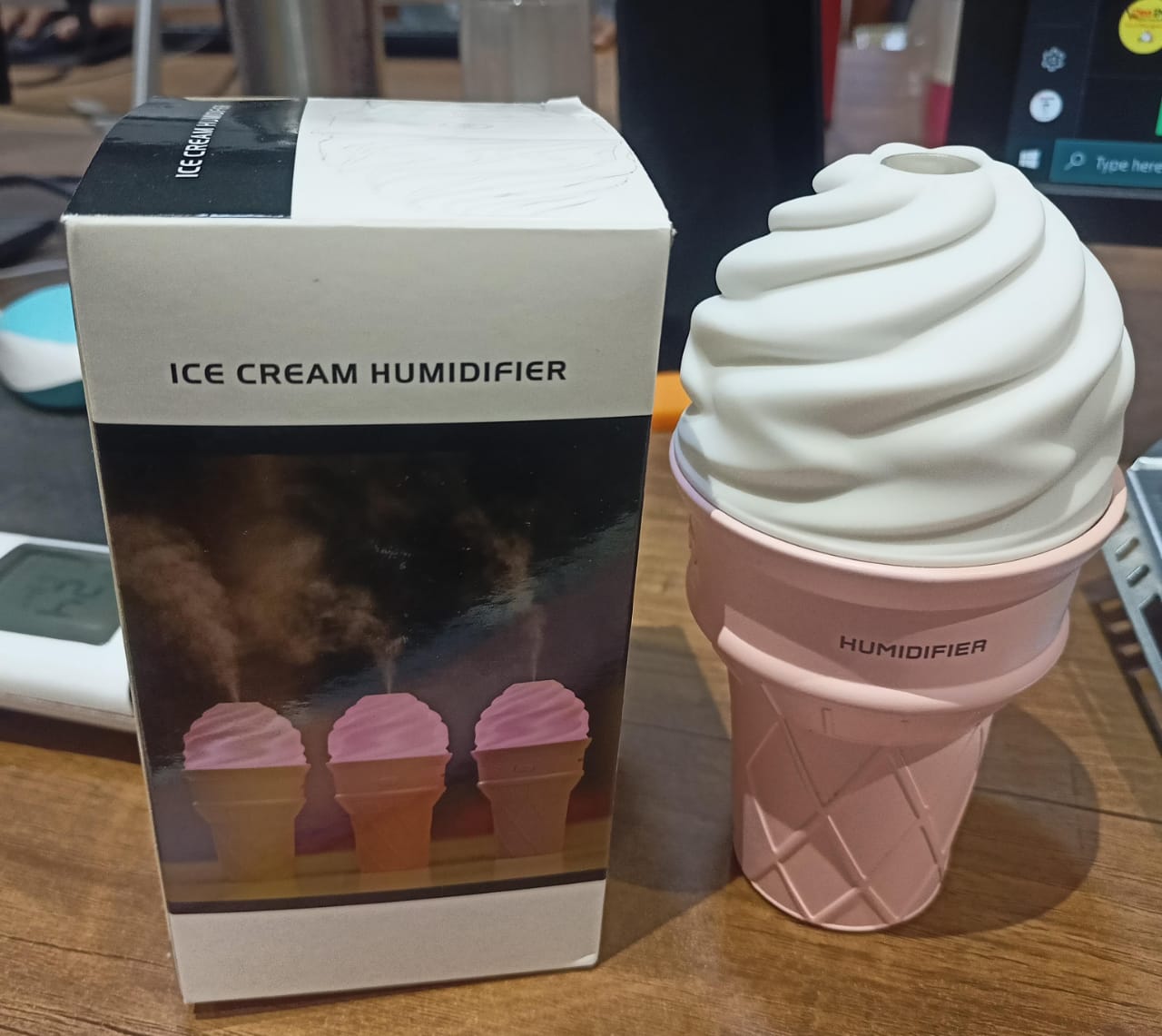 Ice cream cone shaped humidifier misting air with LED nightlight on