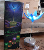 The elegant musical lamp displayed with its petals open, ready to provide both light and soothing melodies.