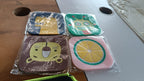 Isolated single silicone lemon drink coaster showing heat-resistant material