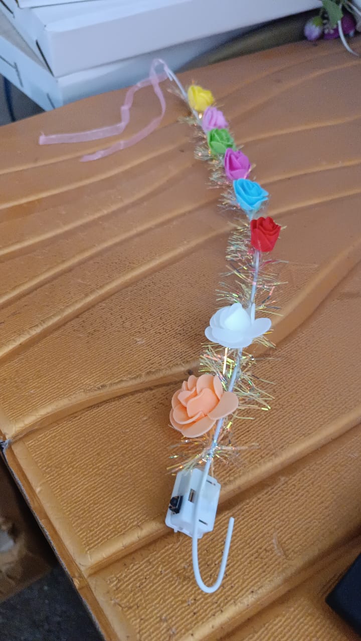 Model wearing LED Flower Crown Headband illuminated with vibrant multicolor LED roses