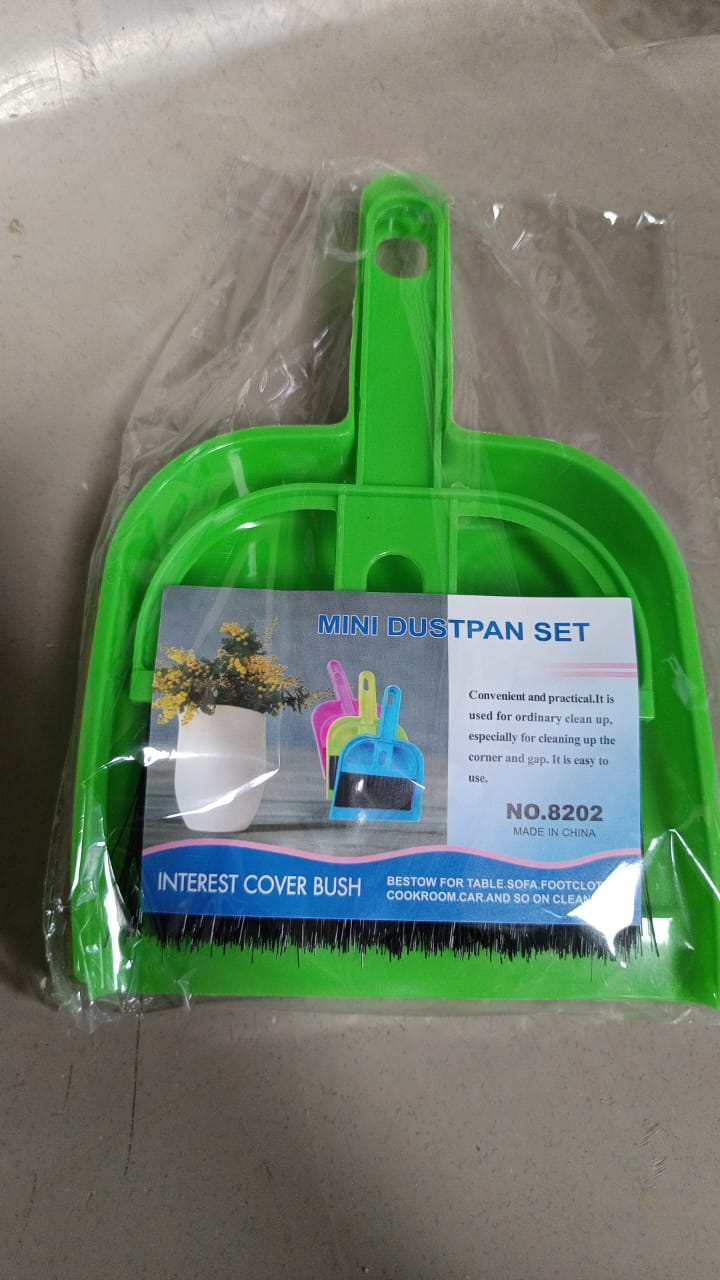 Convenient mini cleaning tool, showing the brush snapping into the dustpan.