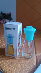 Vertical close-up shot of the elegant oil dispenser bottle, emphasizing its design.