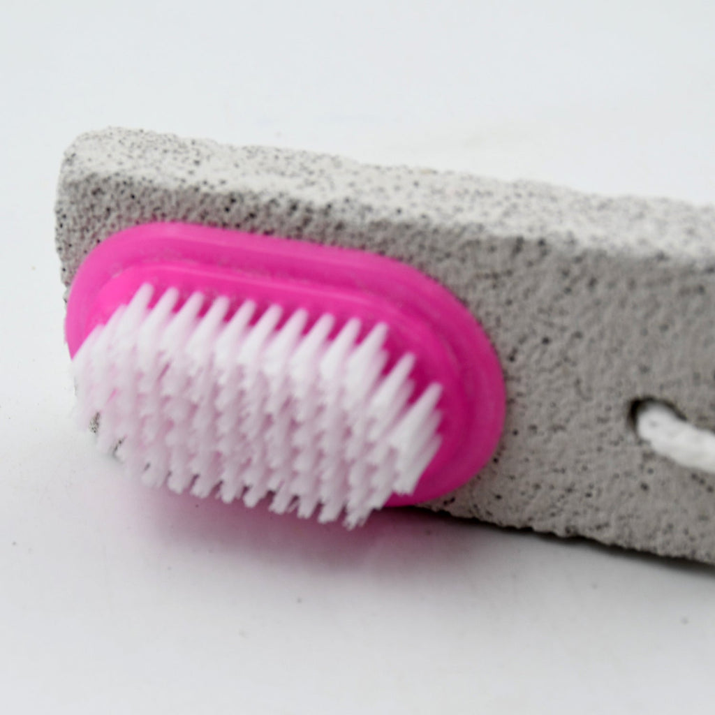 Person using the foot scrubber to gently remove dead skin during a relaxing pedicure.
