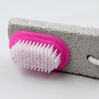 Person using the foot scrubber to gently remove dead skin during a relaxing pedicure.