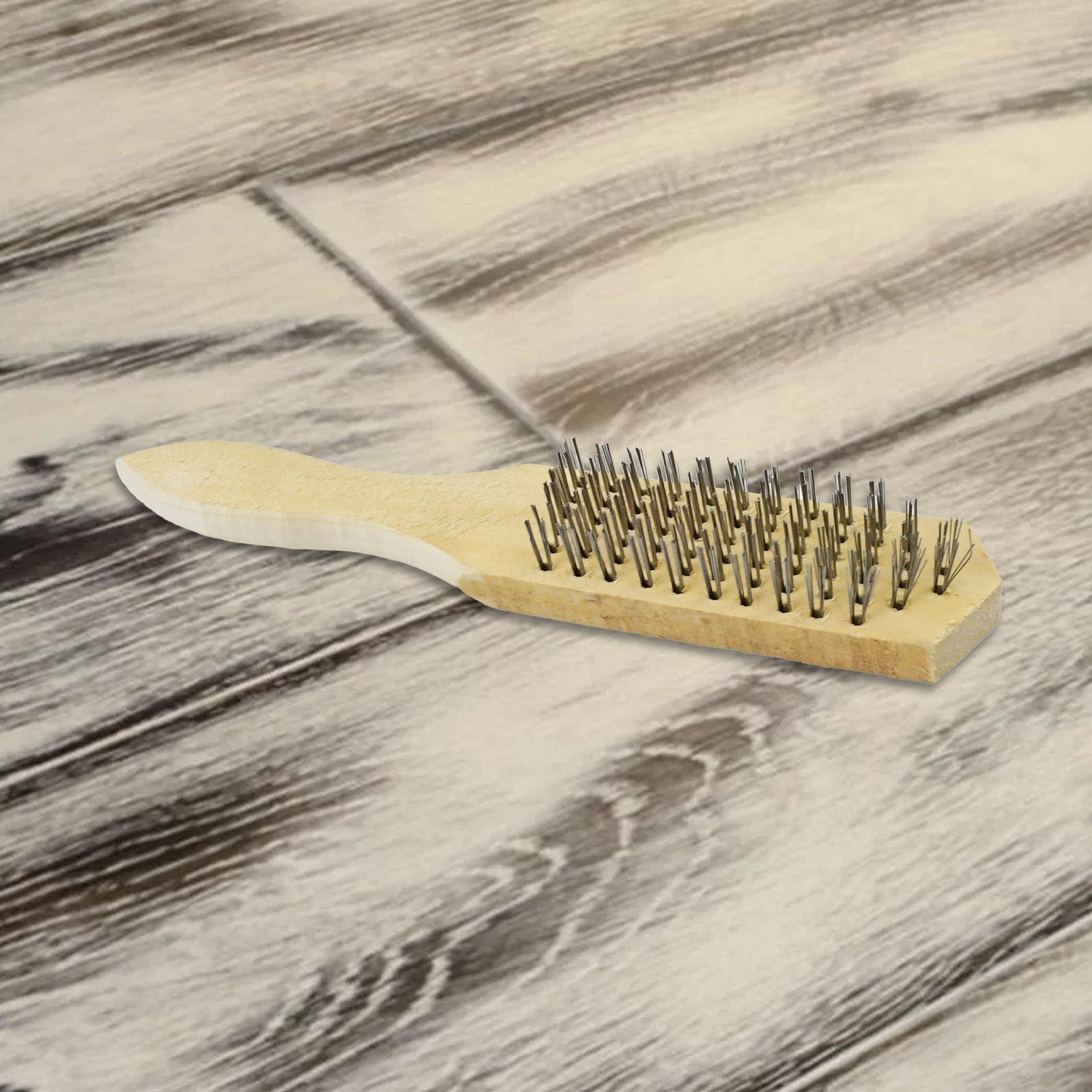 Side view of the heavy-duty steel wire brush, ideal for rust removal.