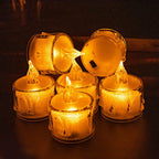Flameless LED tea light candles arranged elegantly on a table, perfect for festive decor.