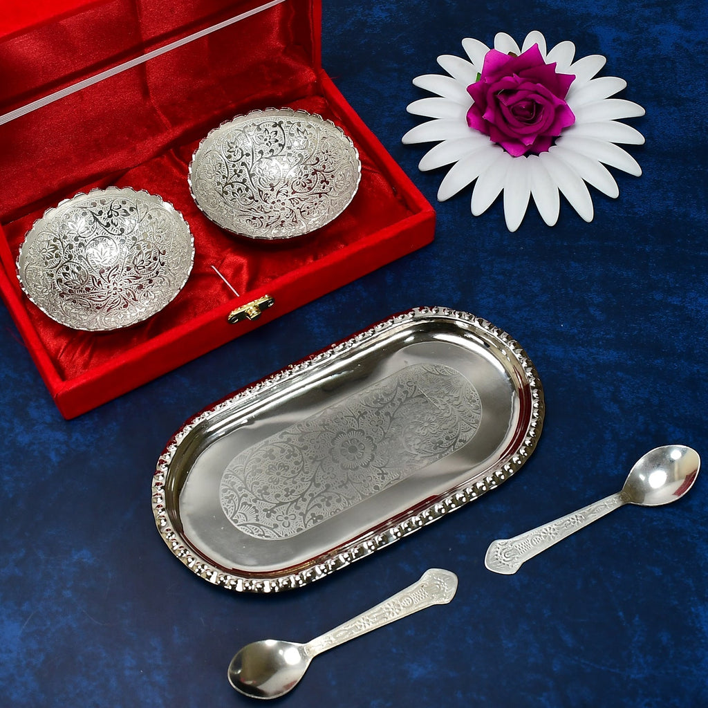 Close-up of the polished silver plated brass serving set, highlighting the intricate details of the bowls and spoons.