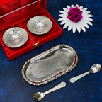 Close-up of the polished silver plated brass serving set, highlighting the intricate details of the bowls and spoons.