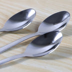 Close-up view of smooth oval bowl of a dining spoon