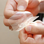 Adhesive wall hook used for home and office organization, keeping spaces tidy.