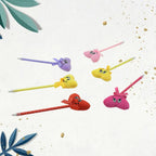 Group of diverse cartoon and heart pens, each with a fun rattle in various colours.