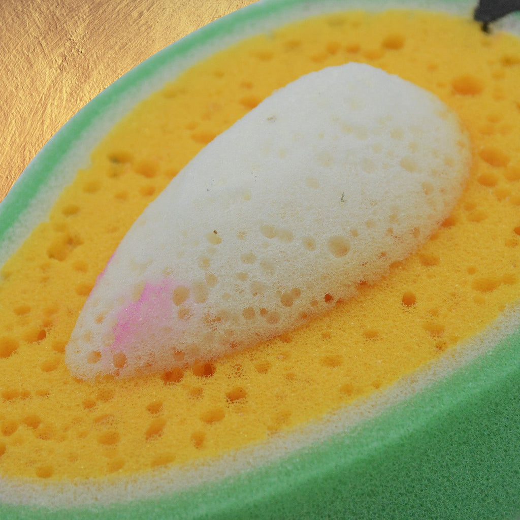 Detailed shot of the Mango Dish Sponge's soft, absorbent material.