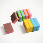 Stack of vibrant, multi-purpose dish cleaning sponges for kitchen use.