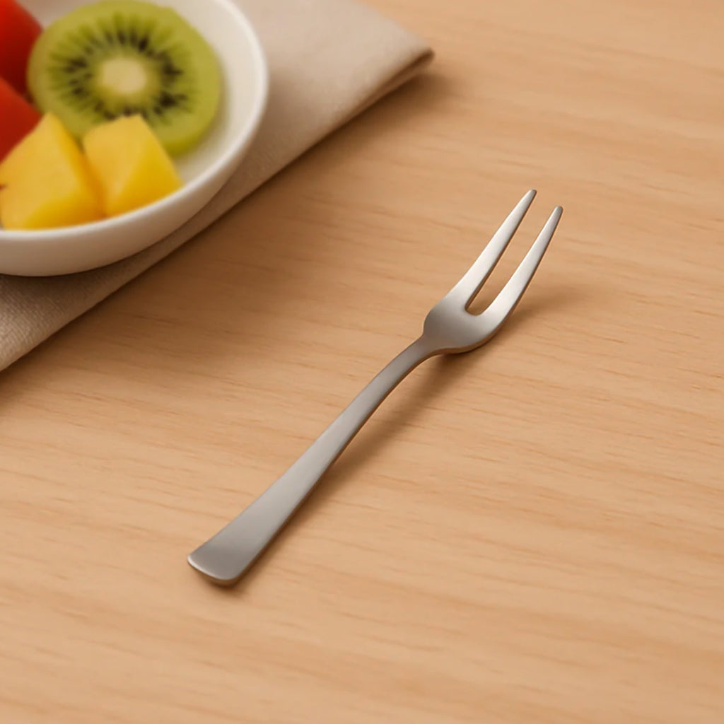 Close-up of a rust-resistant mini fruit fork from the dessert set