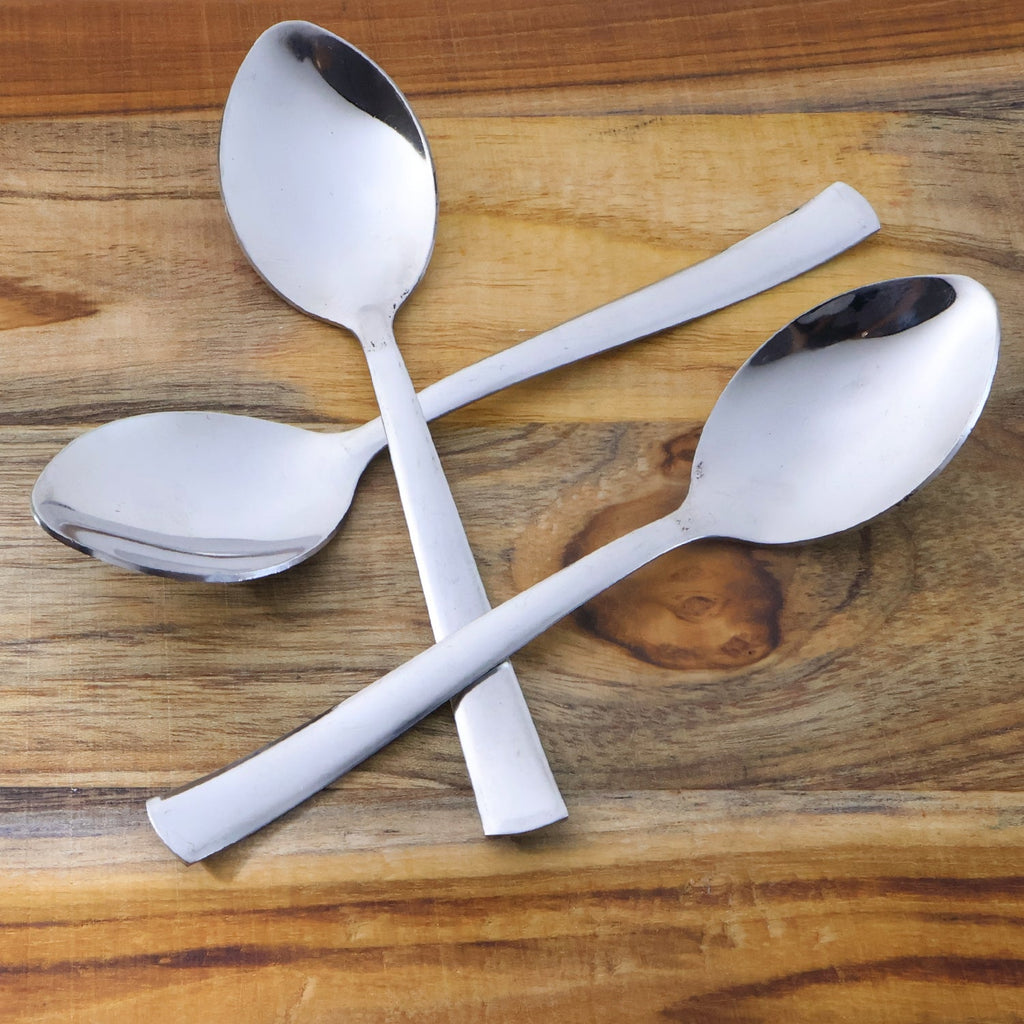 Three rust-resistant dining spoons with smooth oval bowls and comfortable grip handles