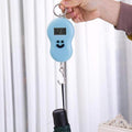 Compact digital weighing scale with LCD display, ideal for travel.