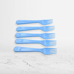 A close-up of the tines of a reusable plastic fork, showing its sturdy construction.