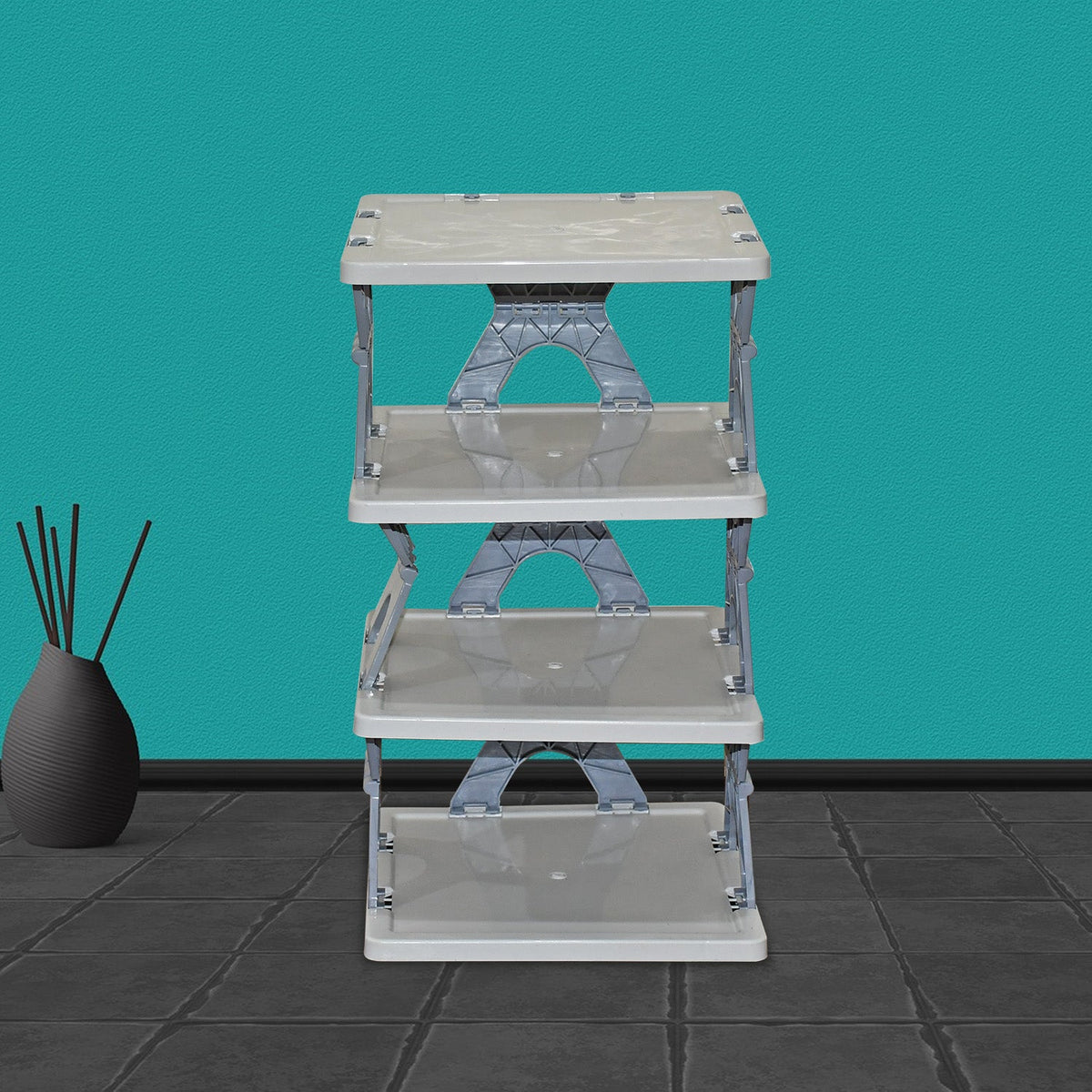 Fully assembled 4-layer foldable shoe rack with various shoes for entryway organization.