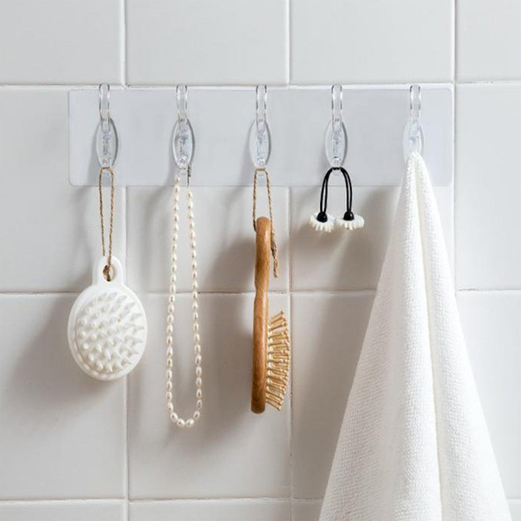 A pack of five transparent adhesive wall hooks from GlimmerHome, ready for damage-free hanging.