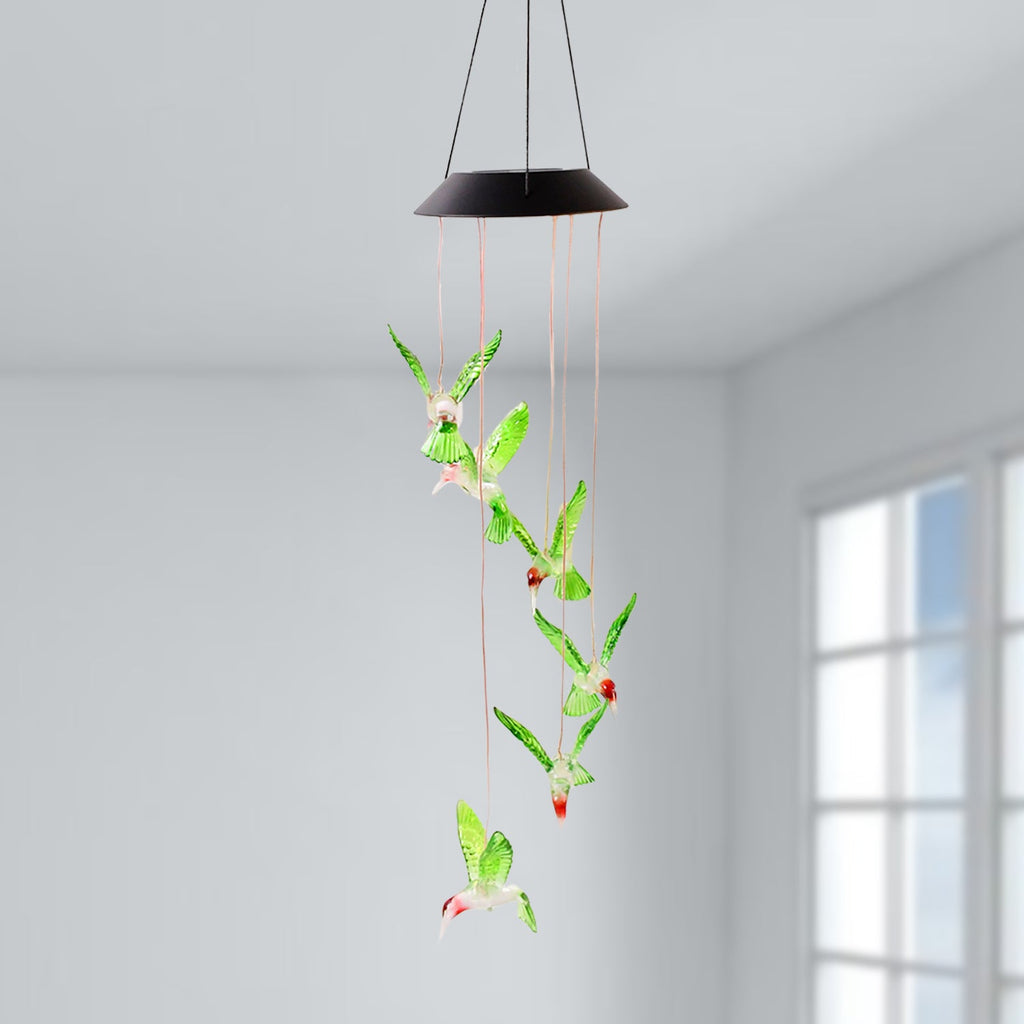 Hummingbird solar wind chimes glowing with vibrant colored LEDs