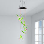 Hummingbird solar wind chimes glowing with vibrant colored LEDs