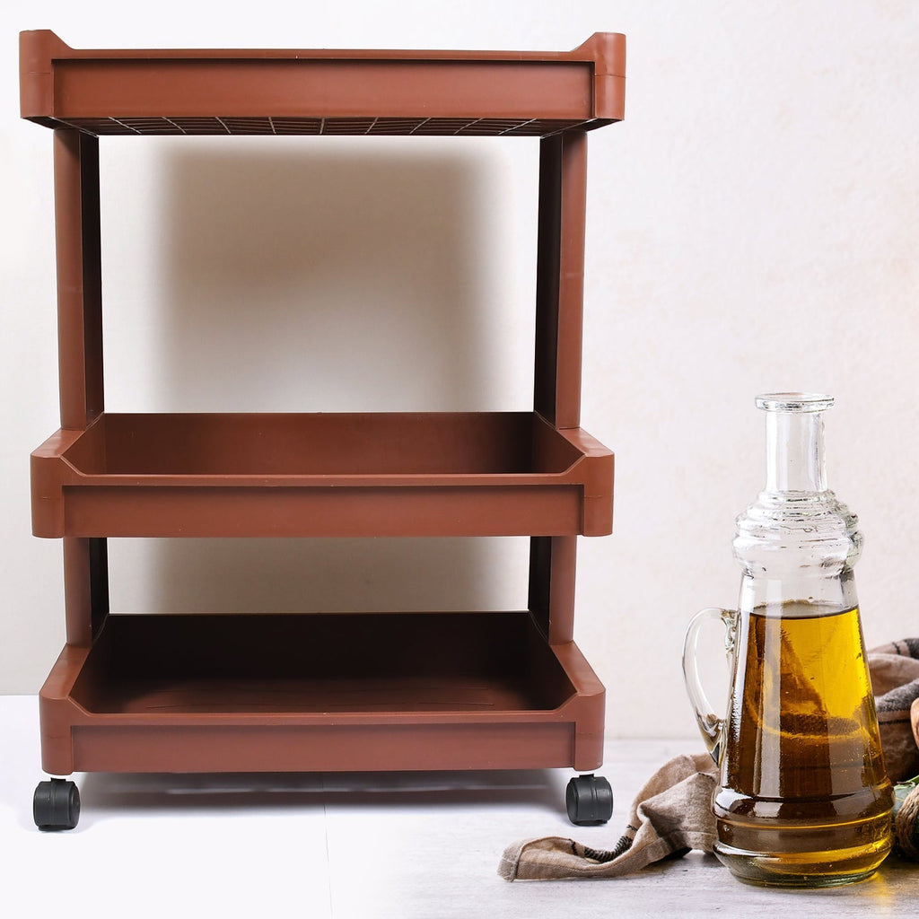 Stylish plastic bar cart ready for serving beverages and snacks.