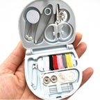 Detailed close-up showing the various tools packed efficiently within the Mini Travel Sewing Kit.