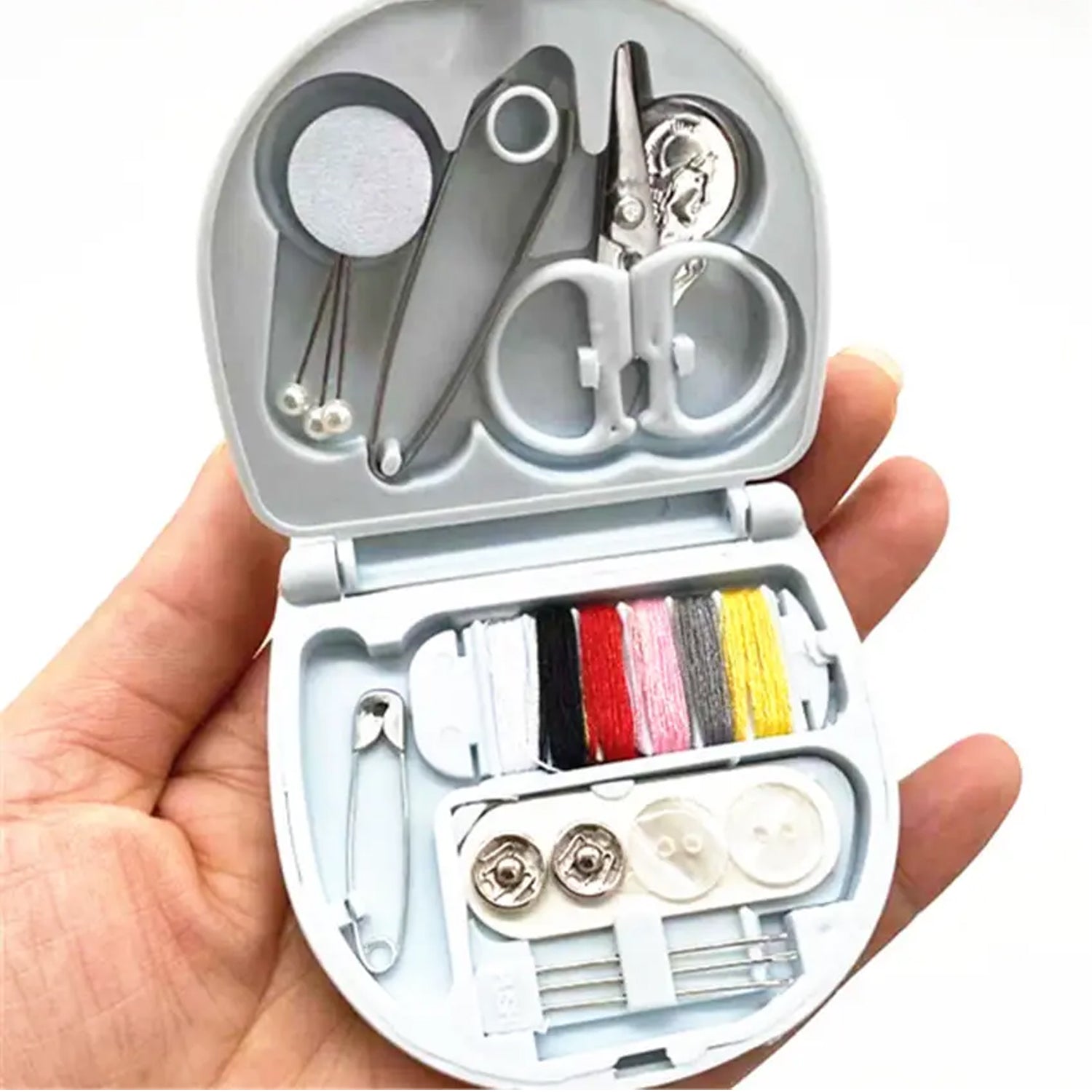 Detailed close-up showing the various tools packed efficiently within the Mini Travel Sewing Kit.