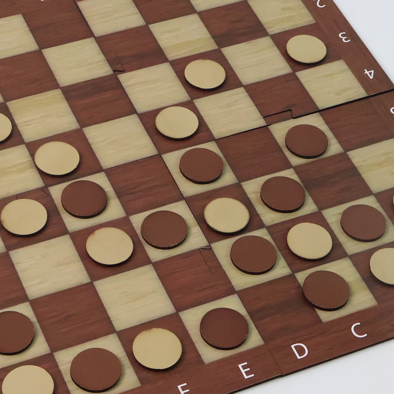 Arrangement of Chess pieces and Checkers coins on the travel game board