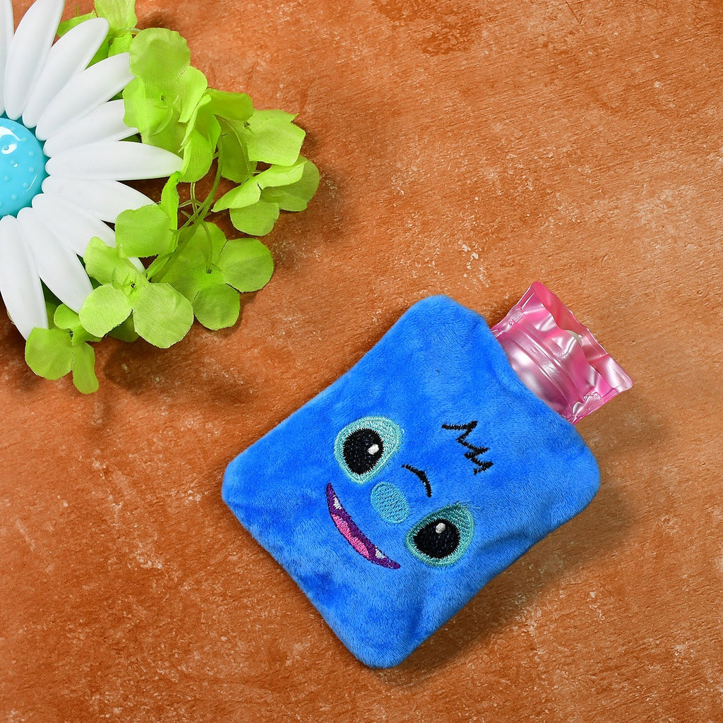Small blue hot water bag with a soft fabric cover, perfect for pain relief.
