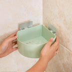 Self adhesive corner shelf installed in a modern bathroom.