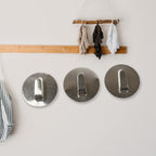 Two heavy-duty wall hooks mounted, demonstrating strong, reliable adhesion.