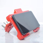 Compact red mobile charging wall holder, ideal for small spaces.