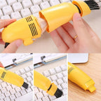 Ergonomic USB mini vacuum cleaner demonstrating its powerful suction.