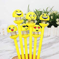 A set of vibrant emoji ballpoint pens, perfect for adding fun to schoolwork.