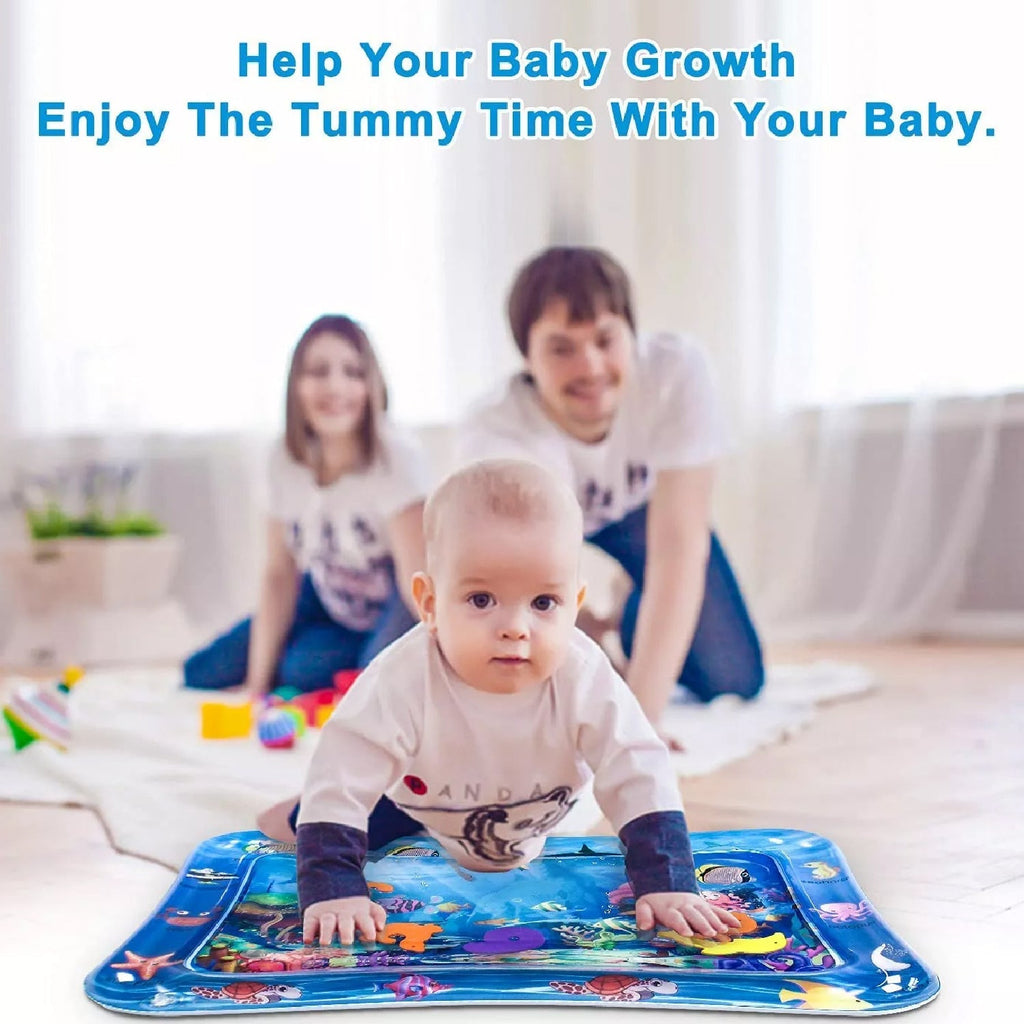 An overhead shot of a baby exploring the tactile surface of a Tummy Time Mat with water.
