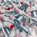 Stack of 100 steel nail gun nails ready for efficient use