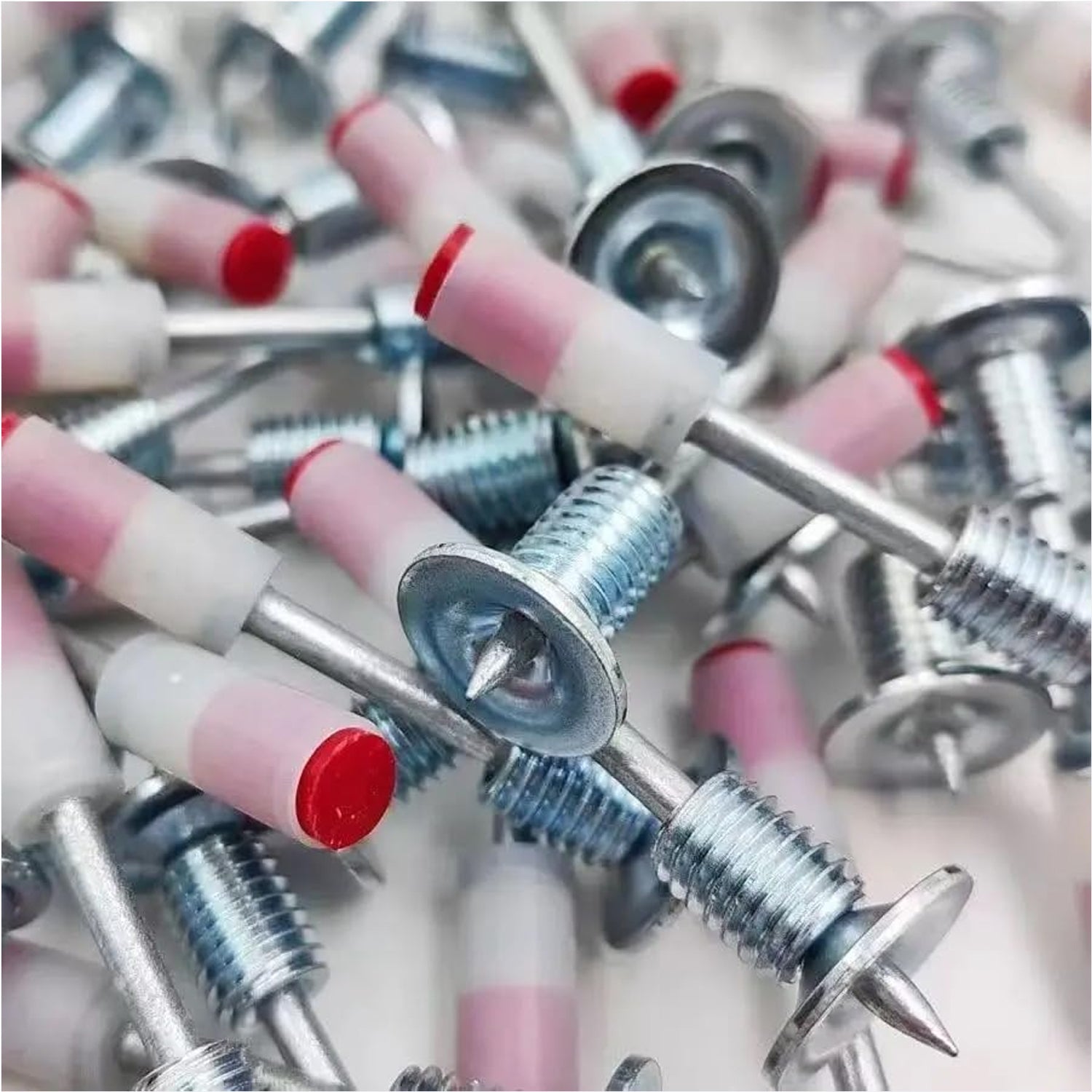 Stack of 100 steel nail gun nails ready for efficient use