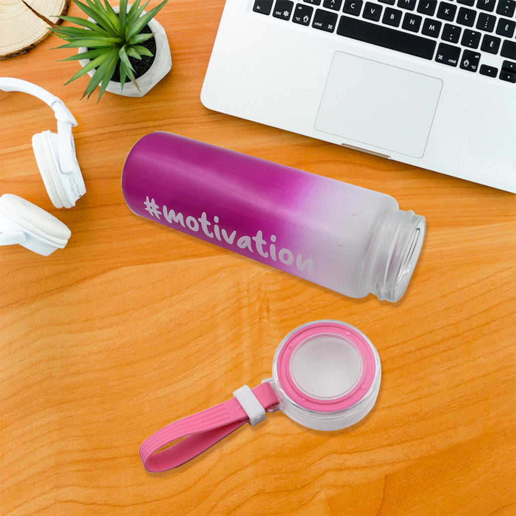 Close-up view of the colorful, inspiring design on the glass water bottle.