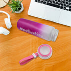 Close-up view of the colorful, inspiring design on the glass water bottle.