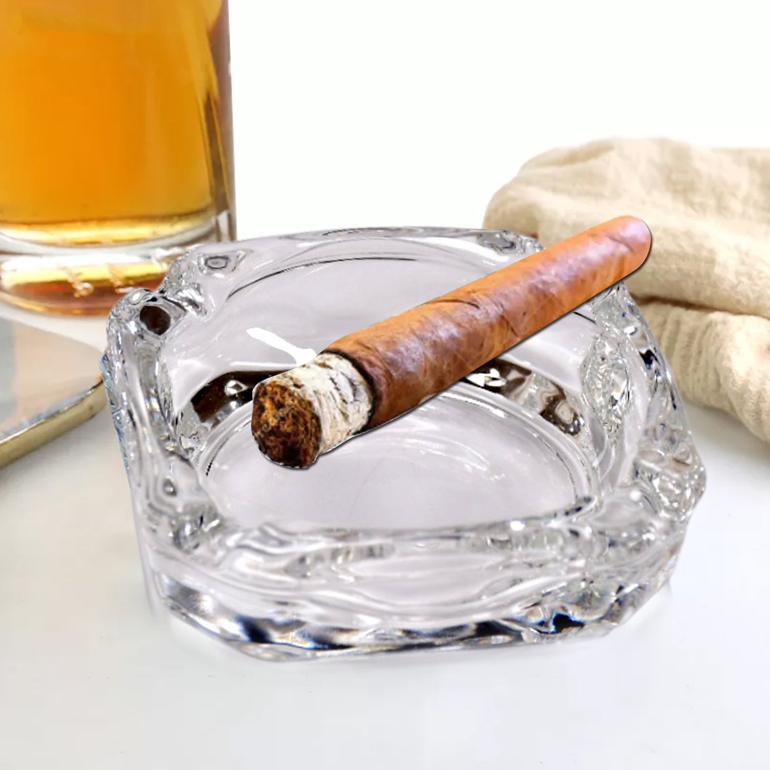 Chic round crystal ashtray, a functional and decorative table accessory.