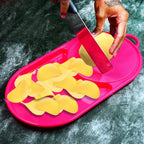 Durable plastic chopping board in a vibrant color, ready for food preparation.