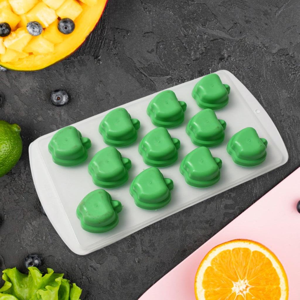 Hand demonstrating flexibility of the silicone fruit shape ice cube tray.