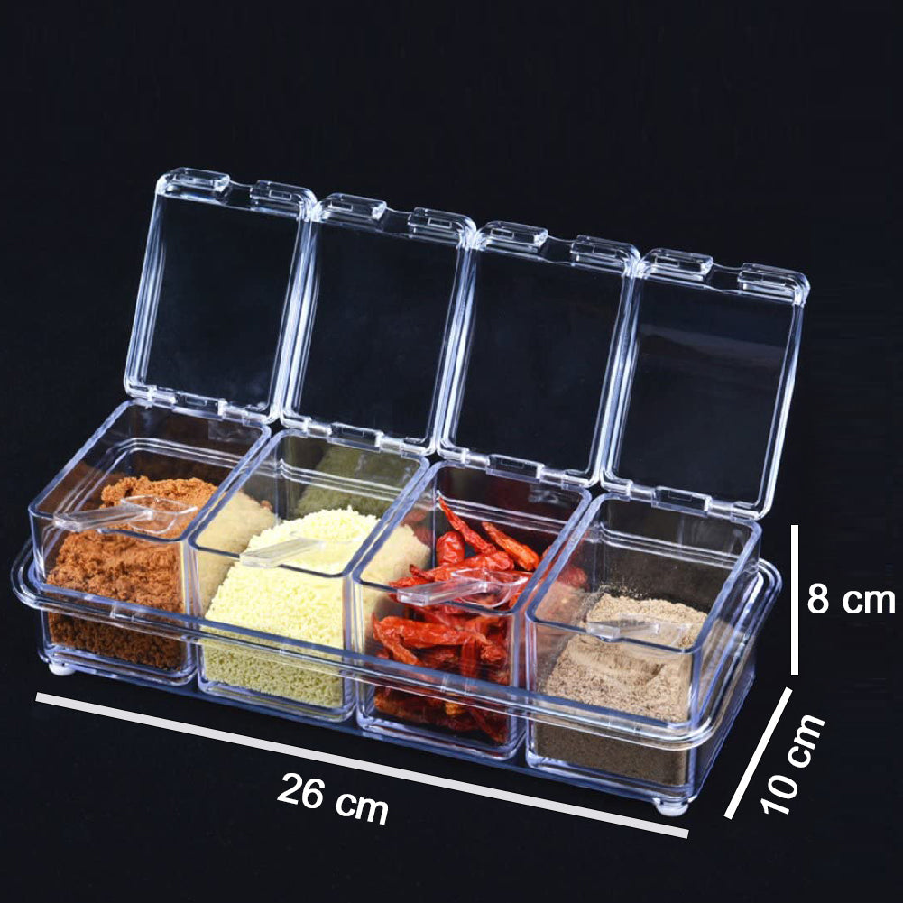 Clear acrylic spice rack with four compartments and spoons.