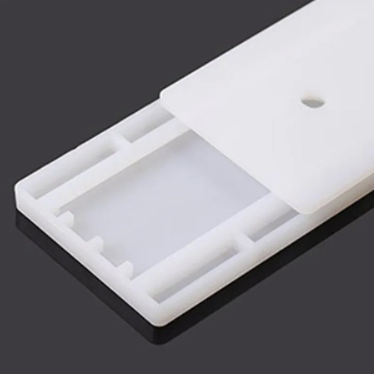 Multi-functional Self Adhesive Plug Organizer applied to a kitchen wall for appliance cords.